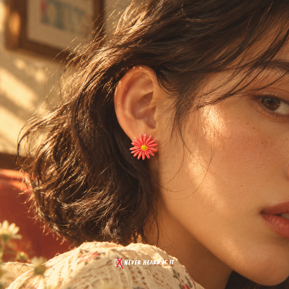 Coral Daisy Enamel Stud Earrings — Coral Daisy worn on an ear