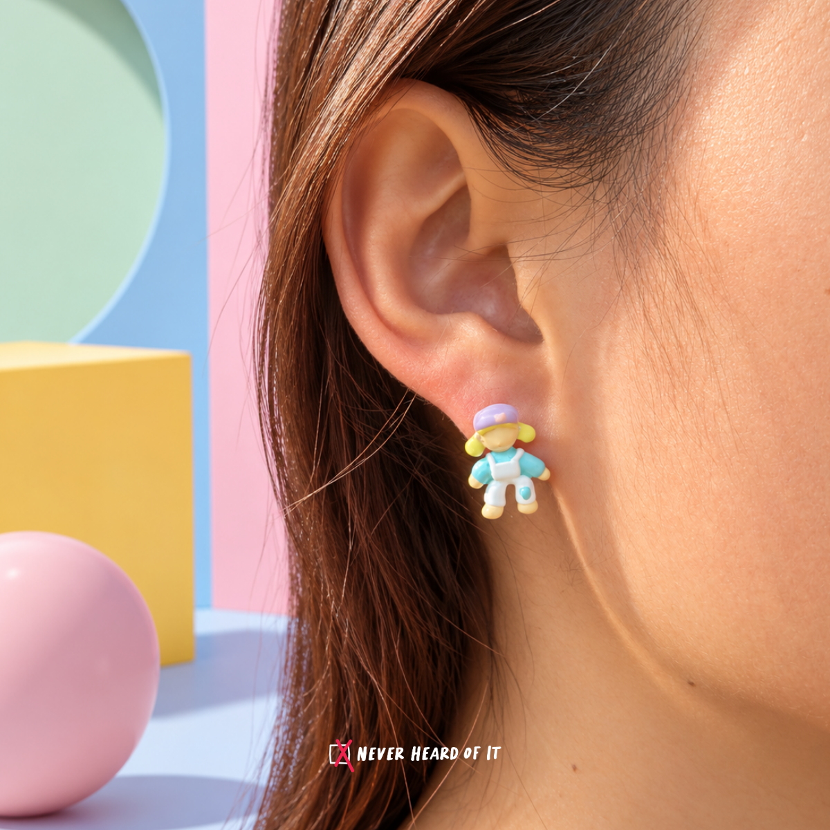 Kindergarten Besties Mismatched Enamel Studs — Blue Hair Doll worn on an ear