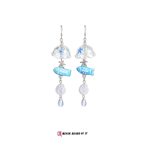 Vitamin Sea beach dangle earrings with waves, umbrella and shells by Never Heard of It