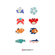 Ocean Series mismatched enamel stud earrings with crab, clownfish and shark by Never Heard of It